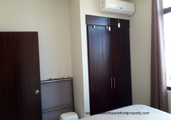 Built-in closet and air conditioning unit in bedroom 2.