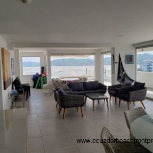 The kitchen and great room with floor to ceiling glass