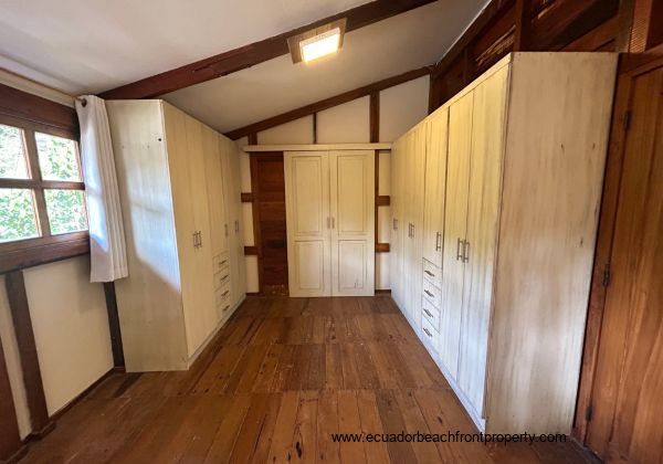 Master bedroom with his and her wardrobes and sliding door to the ensuite bath