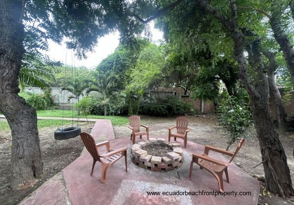 Fenced with yard with firepit