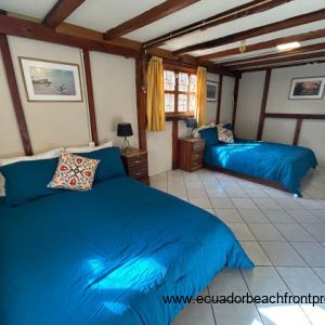 Spacious ground floor bedroom with two double beds