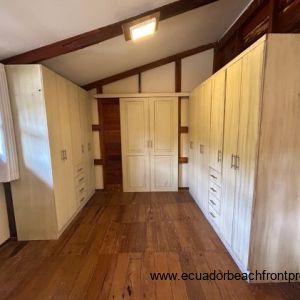 Master bedroom with his and her wardrobes and sliding door to the ensuite bath