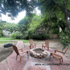 Fenced with yard with firepit