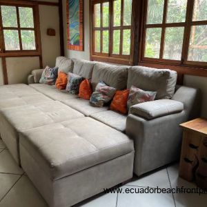 living room with large sectional with movable footrests