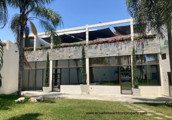 Two garden view apartments with covered parking above 