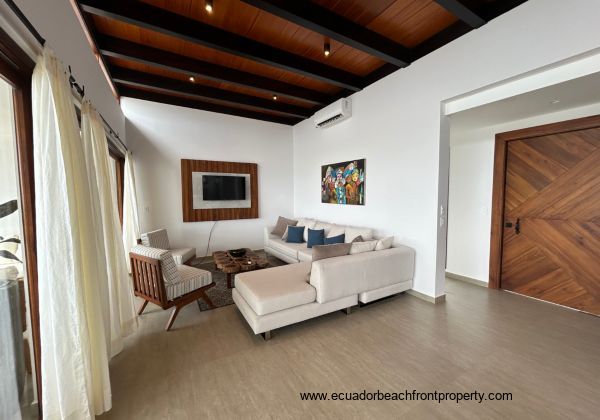 Living room opens to the oceanfront patio