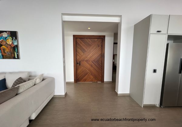 Entrance into the home through a custom made hardwood door.