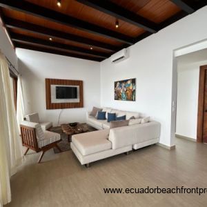 Living room opens to the oceanfront patio