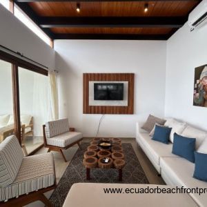 Living room opens to the oceanfront patio