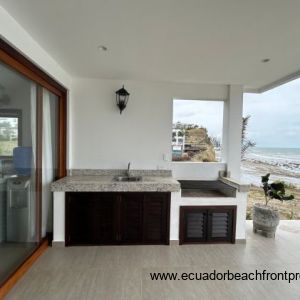 Outdoor kitchen space with sink and grill