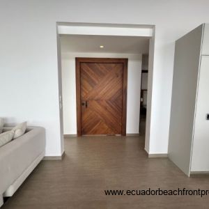 Entrance into the home through a custom made hardwood door.