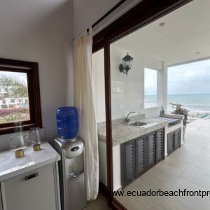 Kitchen opens to the living room and oceanfront patio