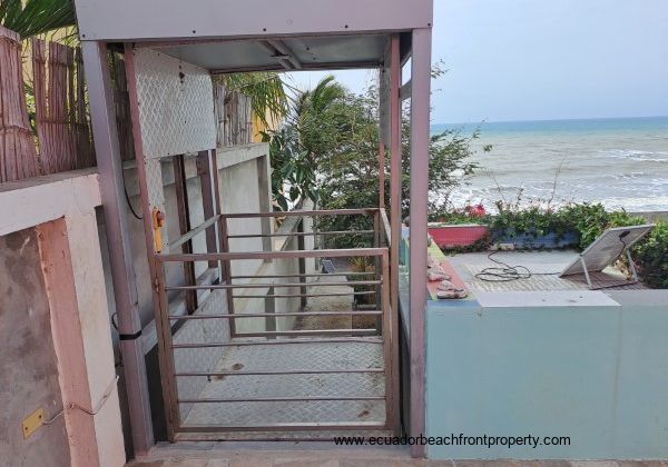 A chair lift between the house and the lower part of the oceanfront yard 