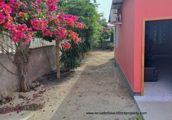 Guest suite exterior with bougainvillea flowers