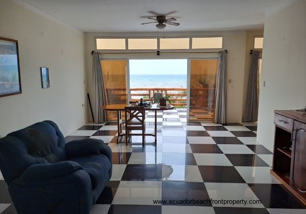 Living room off the kitchen opens to the oceanfront terrace