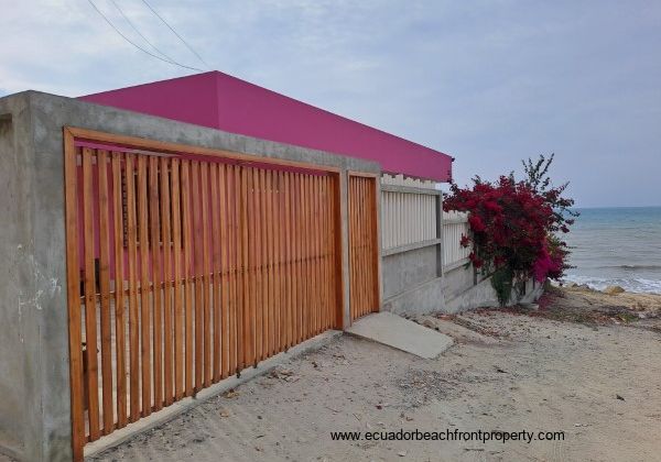 From the road there is a wooden automatic gate to drive onto the property to park.