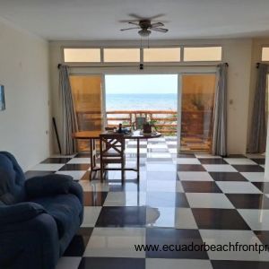 Living room off the kitchen opens to the oceanfront terrace