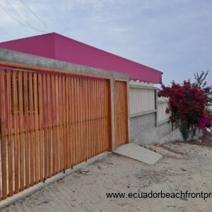 From the road there is a wooden automatic gate to drive onto the property to park.